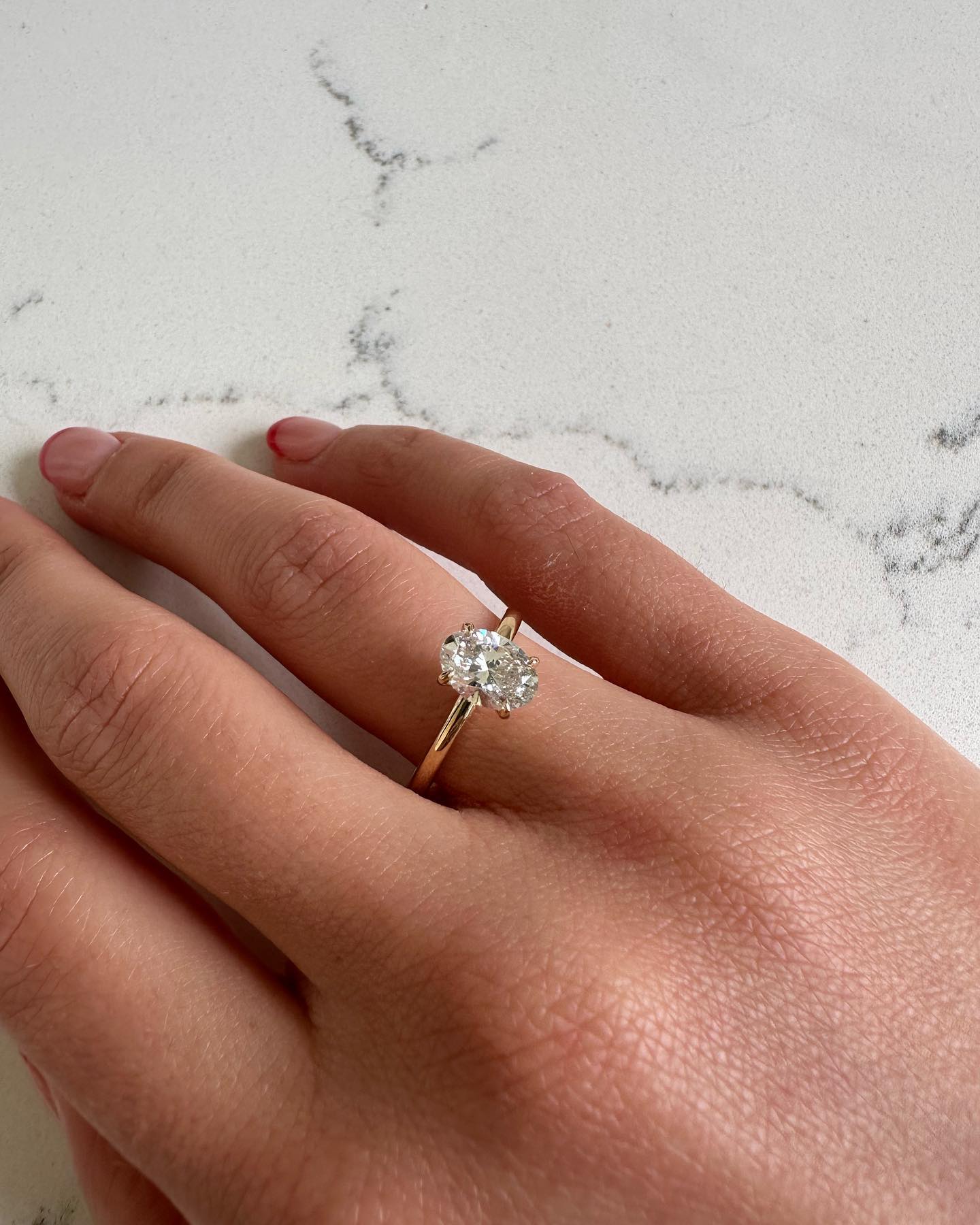 Oval solitaire engagement ring